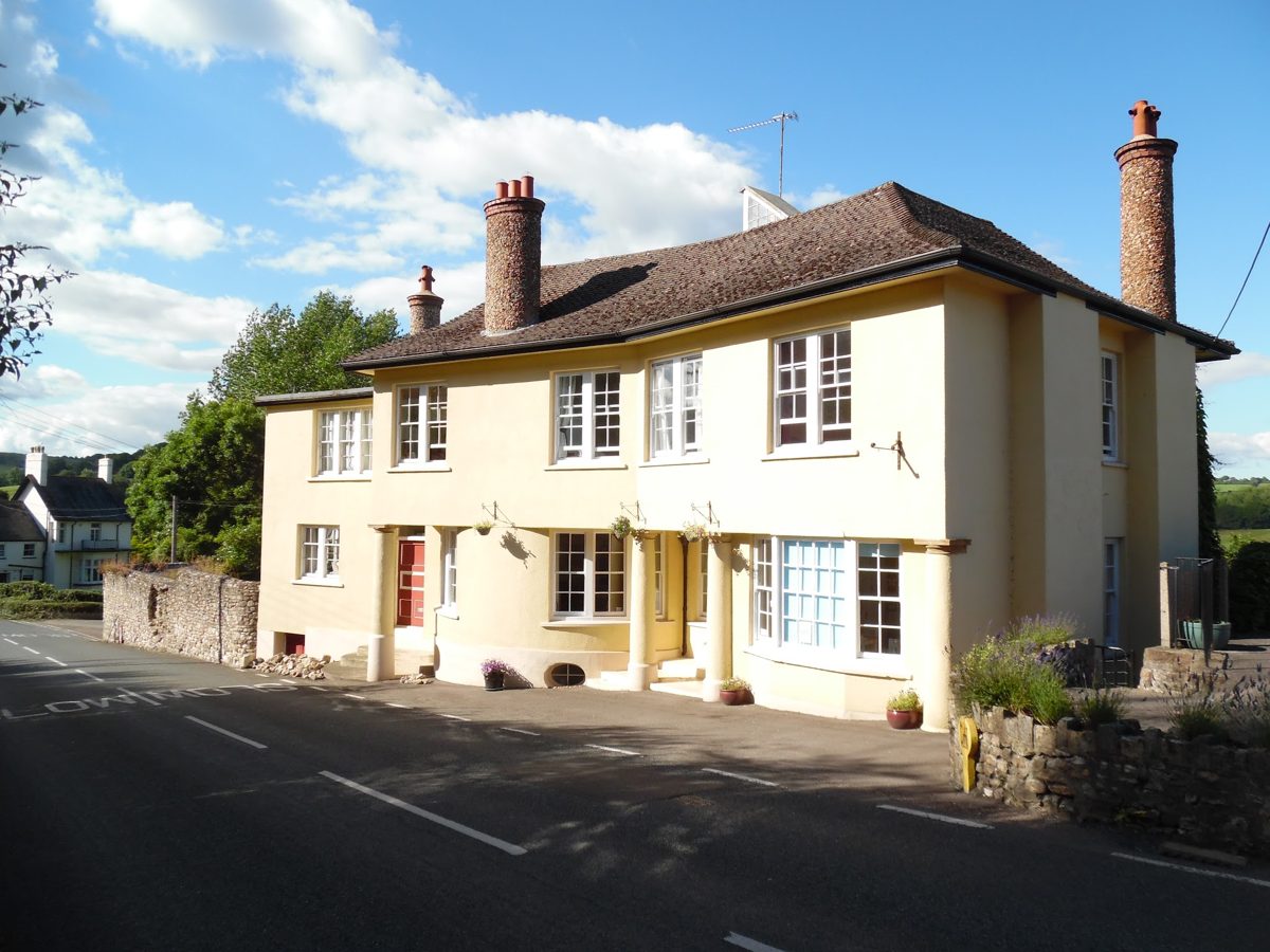 The cream-painted building on Lyme Road